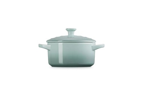 Le Creuset mini round cocotte Sea Salt interior glaze, nonstick release for quick cleanup.