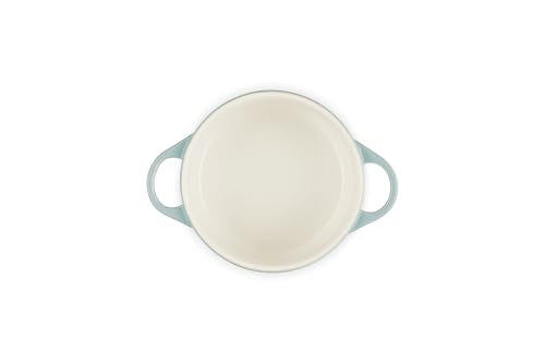 Le Creuset mini round cocotte ready for bake, showing even browning potential.