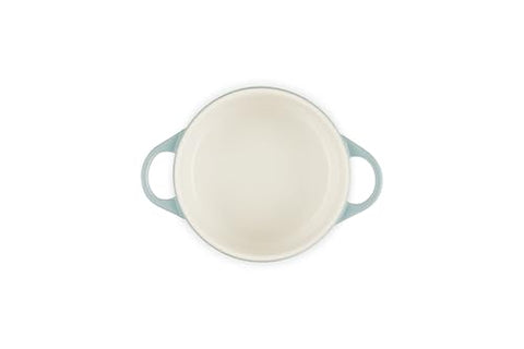 Le Creuset mini round cocotte ready for bake, showing even browning potential.