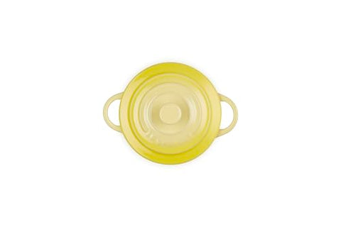 Le Creuset mini round cocotte Soleil side handle demonstrates easy grip for serving.