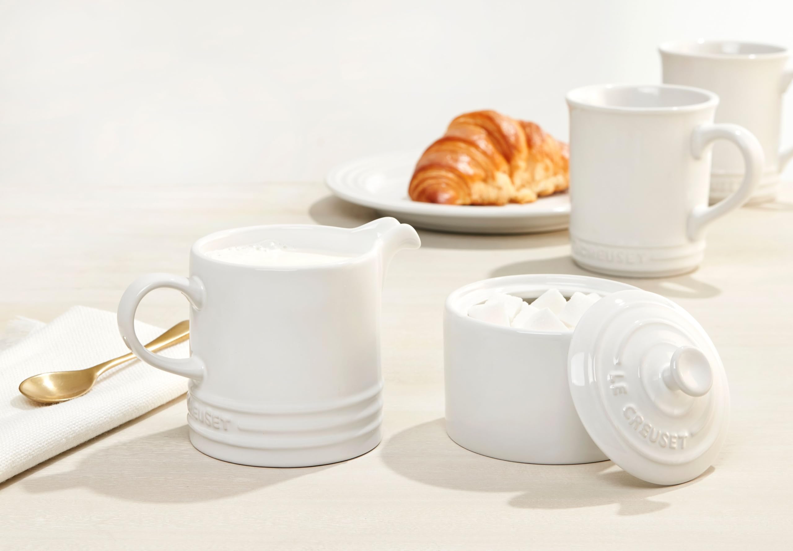 Le Creuset 14 oz white mug set on display showing cohesive collection