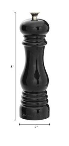 Le Creuset pepper mill in a stylish kitchen display ready for seasoning.