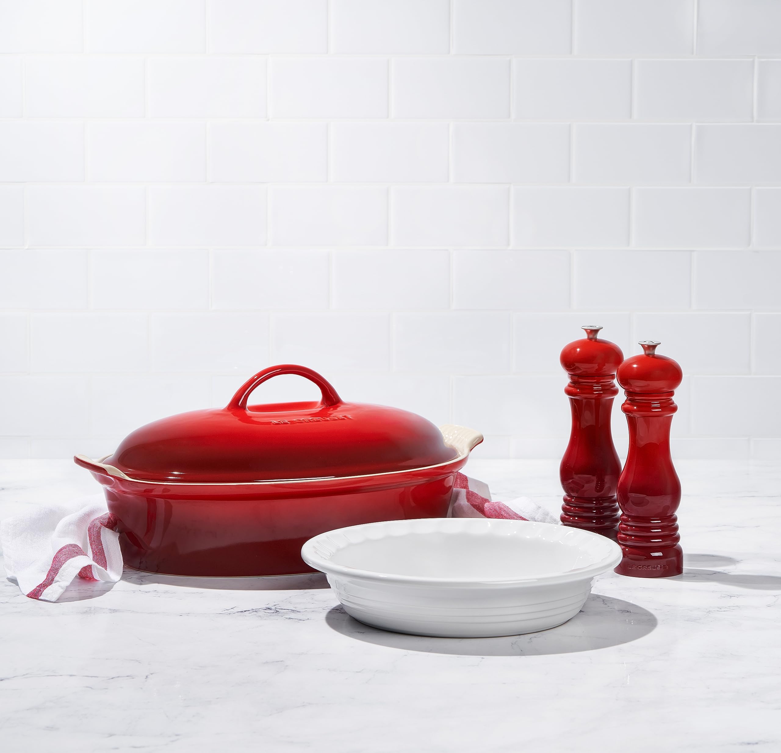 Le Creuset pepper mill cerise on kitchen counter adds color and style