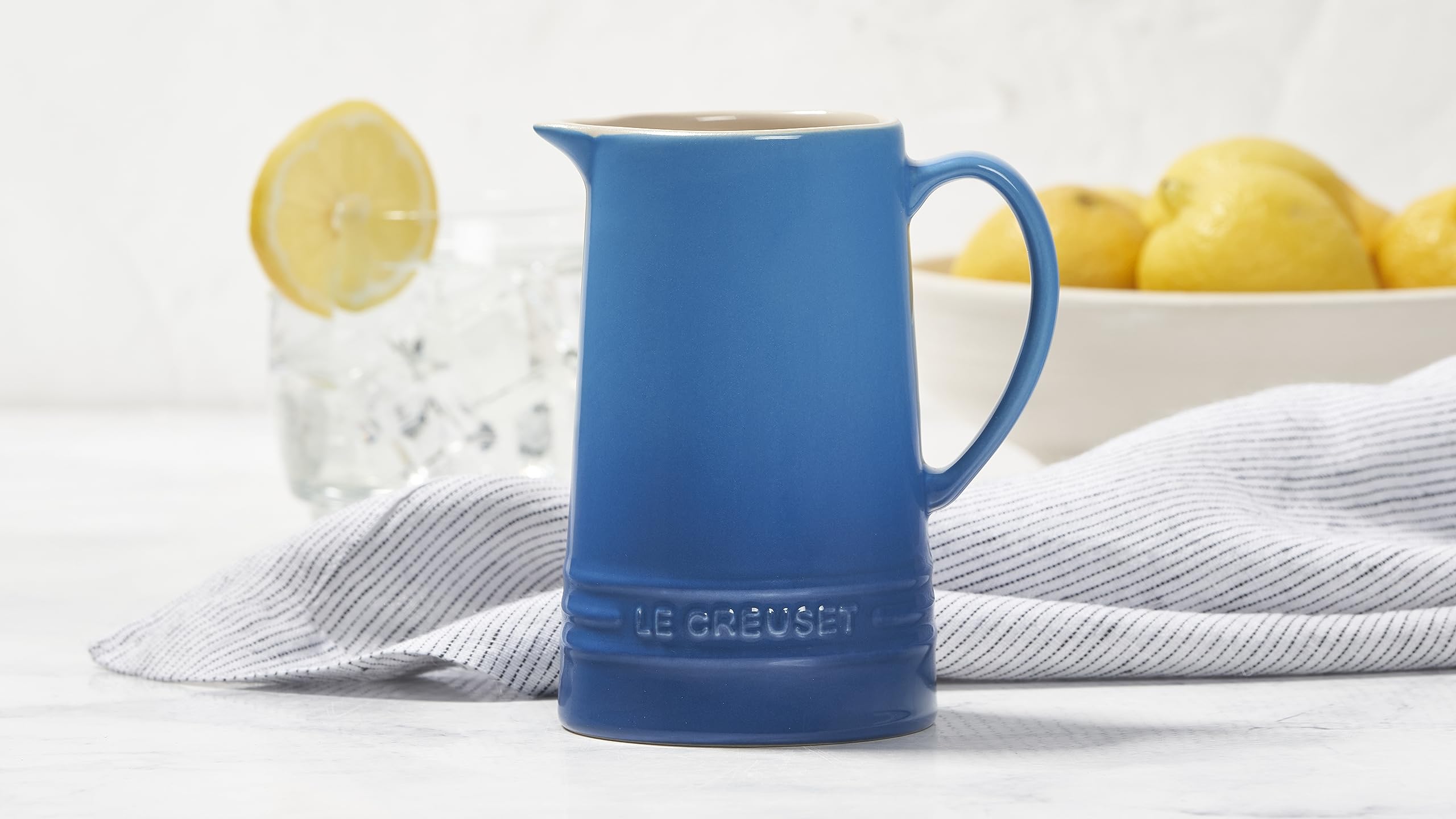 Le Creuset 10 oz pitcher spout close-up emphasizes easy-pour design and minimal drips.