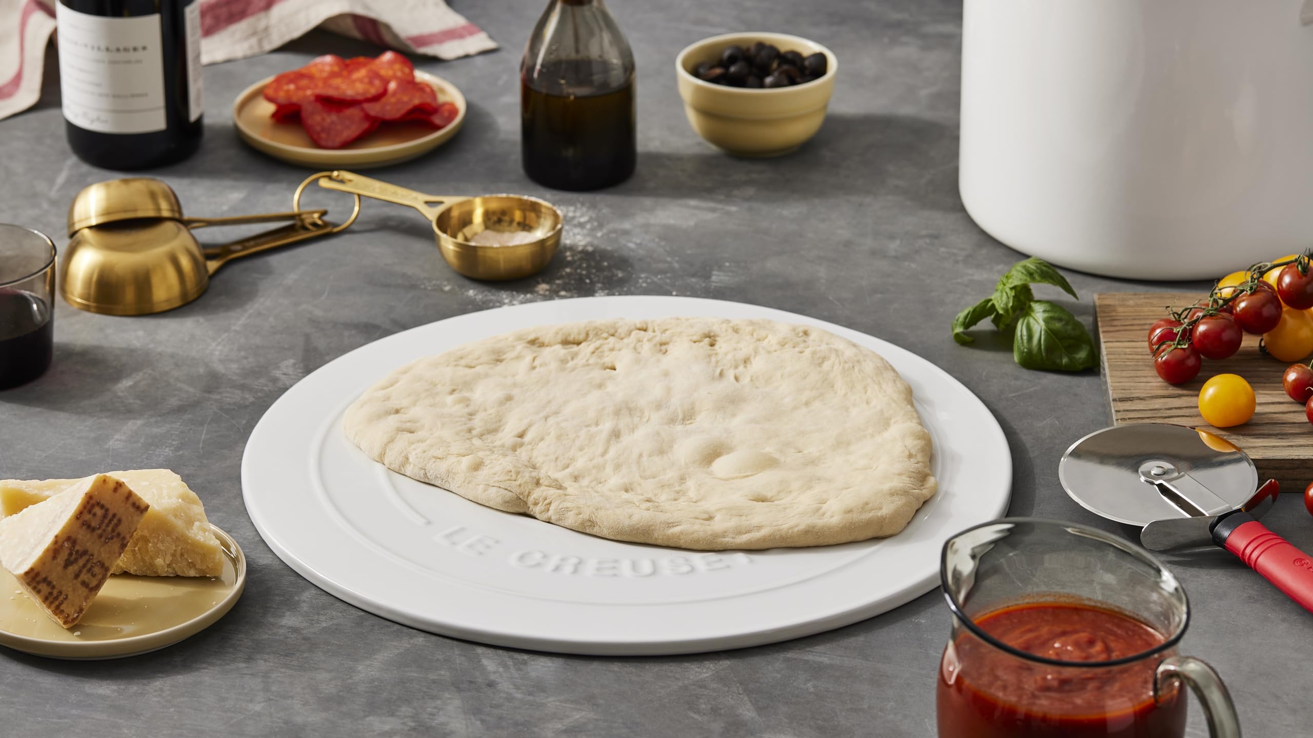 Le Creuset cerise pizza stone resists stains and flavor absorption
