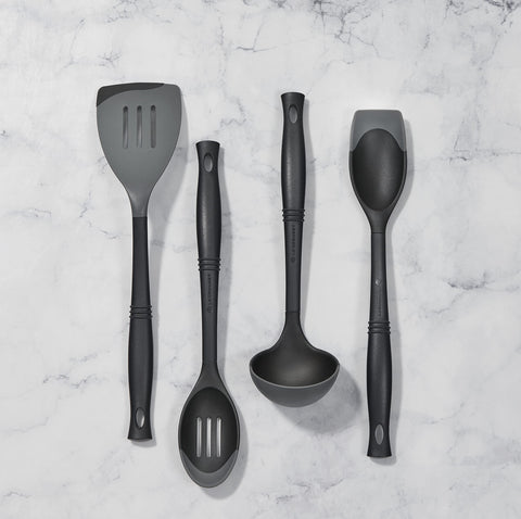 Le Creuset Revolution spatula with ergonomic elliptical handle for comfortable control during cooking.