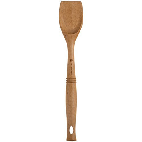Le Creuset Revolution scraping spoon features hanging eyelet for easy kitchen storage.