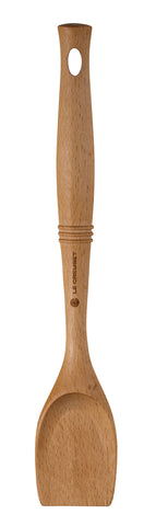 Le Creuset Revolution scraping spoon with wood handle for gentle nonstick scraping.