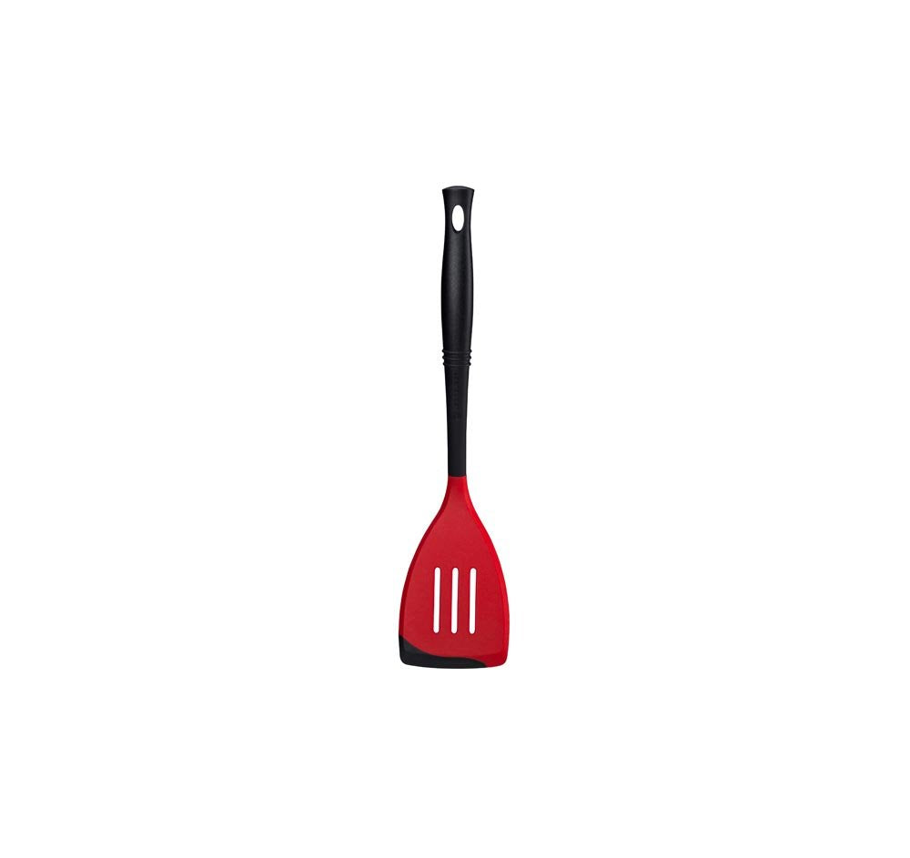 Le Creuset Revolution spatula silicone-edge for gentle flipping on nonstick cookware.