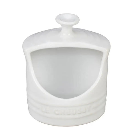Le Creuset salt crock with side-opening for easy salt access during cooking.