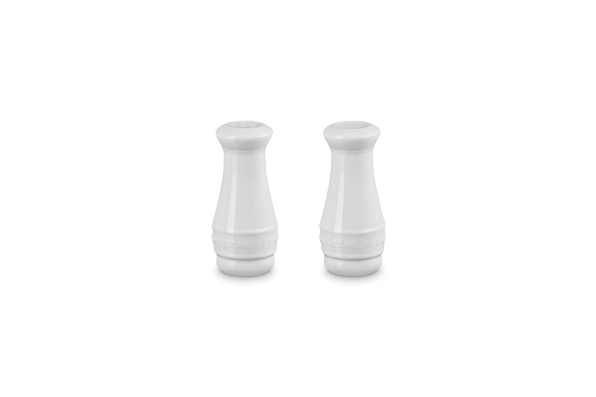 Le Creuset white salt and pepper shakers—side view, durable stoneware for daily use.