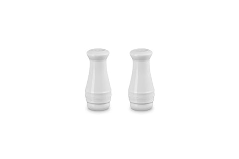 Le Creuset white salt and pepper shakers—side view, durable stoneware for daily use.
