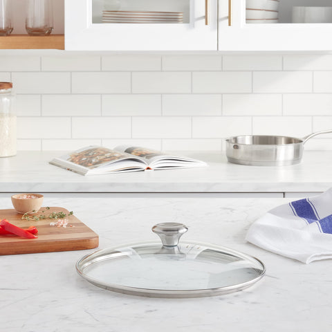 Le Creuset glass lid is oven-safe to 425F for finishing dishes in the oven