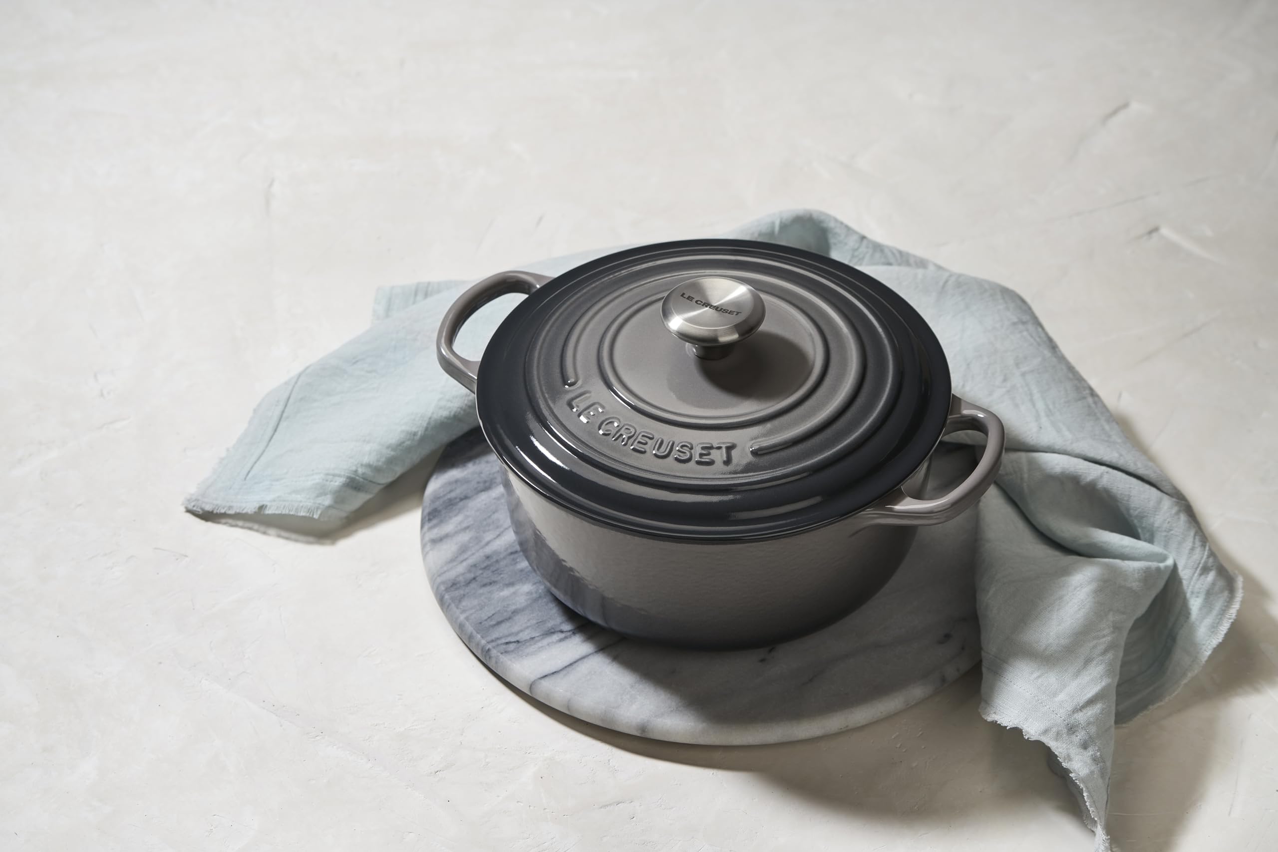Le Creuset Oyster interior light color helps monitor browning and sauce reduction.