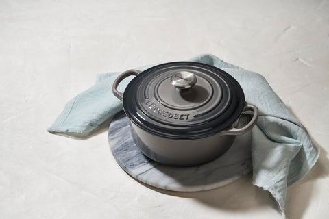 Le Creuset Oyster interior light color helps monitor browning and sauce reduction.
