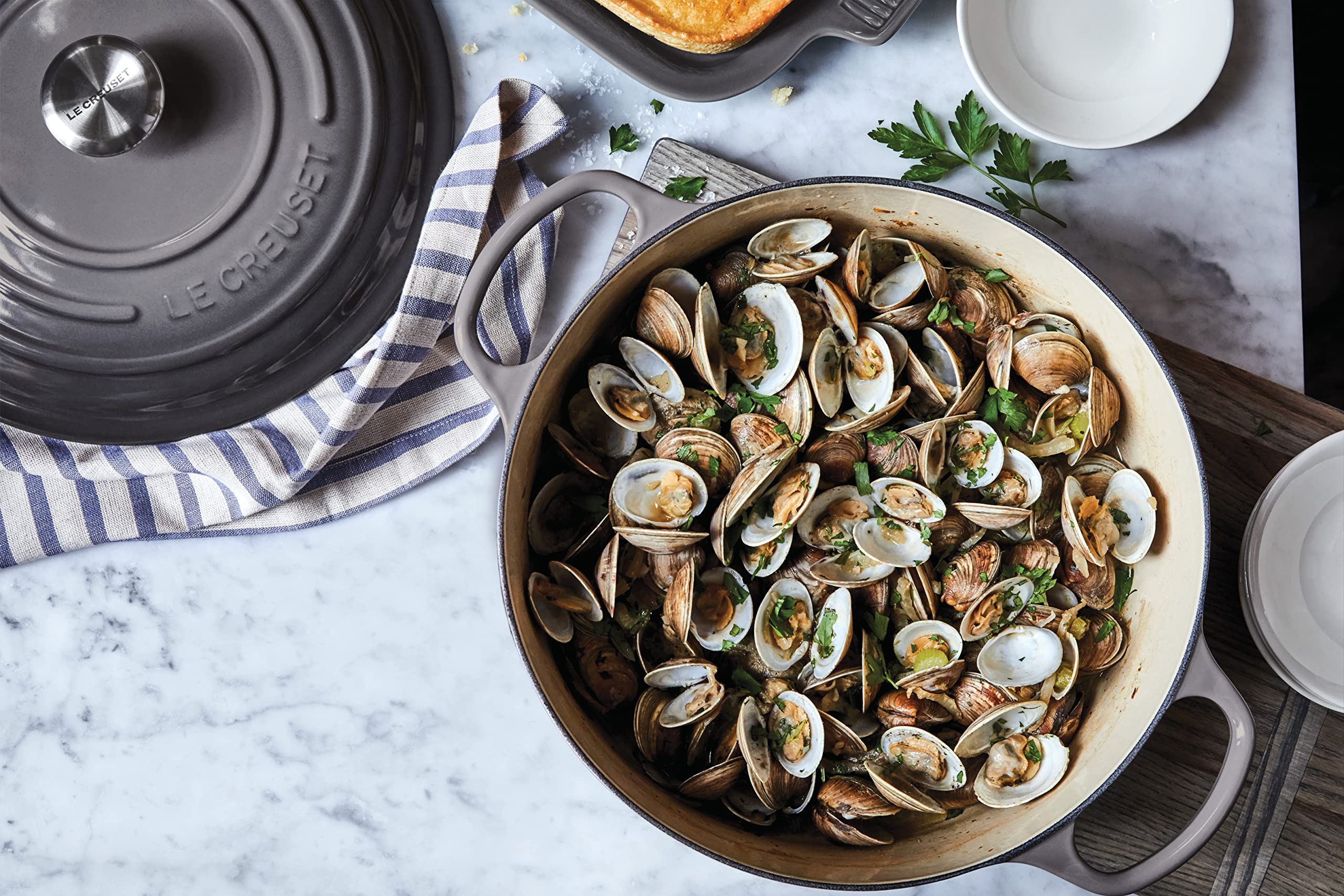 Le Creuset Oyster stainless steel knob remains safe at high oven temperatures.