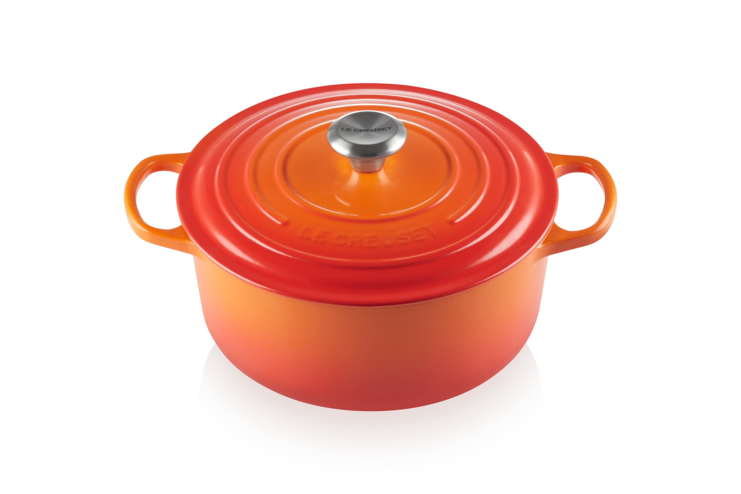 Le Creuset Signature round Dutch oven in flame exterior highlights durability and color for searing and braising.