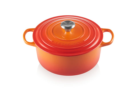 Le Creuset Signature round Dutch oven in flame exterior highlights durability and color for searing and braising.