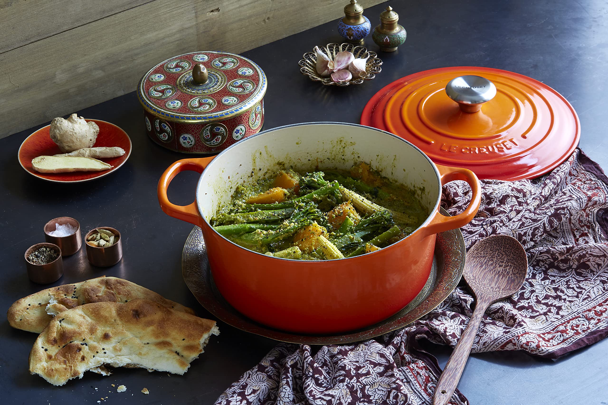 Le Creuset Signature round Dutch oven flame in oven demonstrates oven-safe versatility.