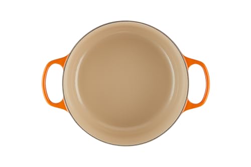 Le Creuset lid with stainless steel knob locks in moisture and aroma during cooking.