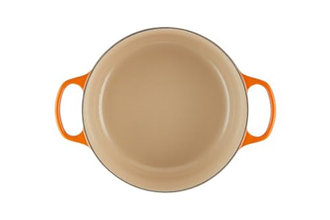 Le Creuset lid with stainless steel knob locks in moisture and aroma during cooking.