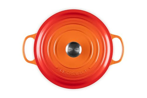 Le Creuset Dutch Oven with lid off shows glossy interior enamel for easy monitoring.
