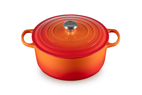 Le Creuset Signature Round Dutch Oven in flame with lid on, ideal for braising.