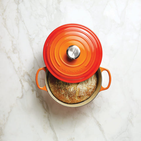 Le Creuset table-ready presentation shows vibrant enamel and durable construction.