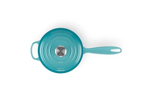 Le Creuset Signature Saucepan Caribbean interior view on the stove for even heating.
