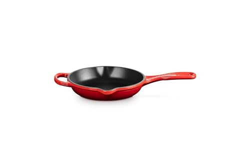 Le Creuset Signature skillet Cerise on the stove providing even heat for browning