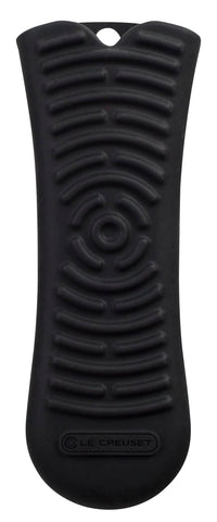 Le Creuset silicone Cool Tool handle in black for a secure, heat-resistant grip on hot cookware.