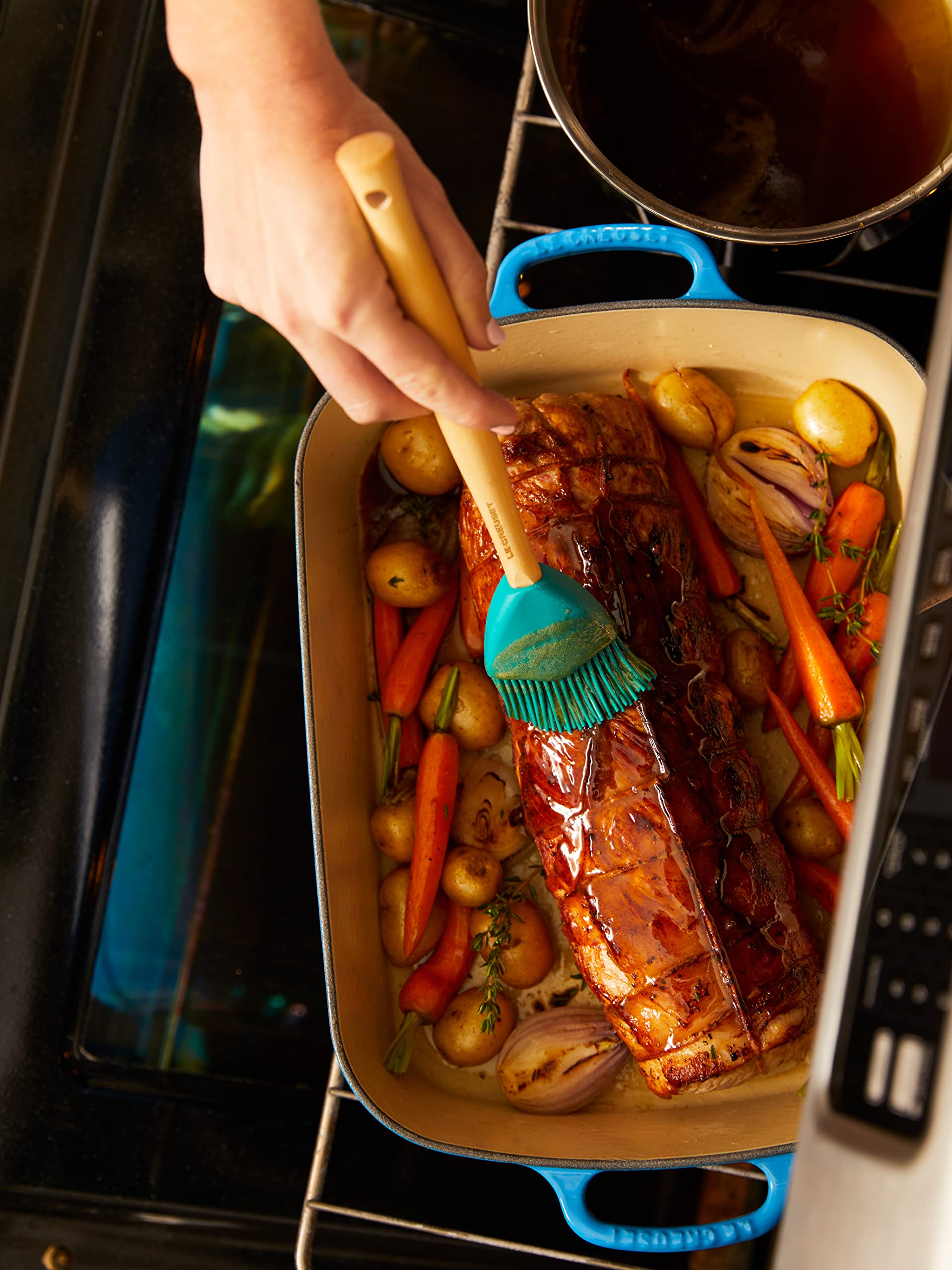 Le Creuset basting brush removable head dishwasher-safe for easy cleanup.