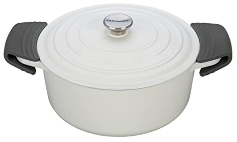 Le Creuset oven-ready silicone grips protect hands during oven transfers and steady lifting.