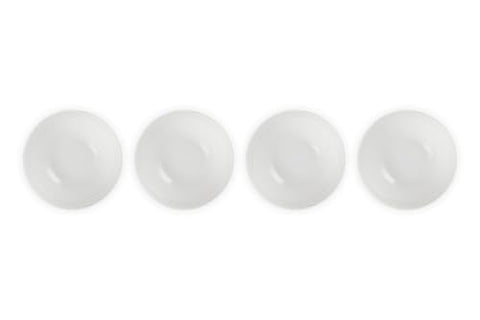 Le Creuset white bowls on table setting for elegant dining and color.