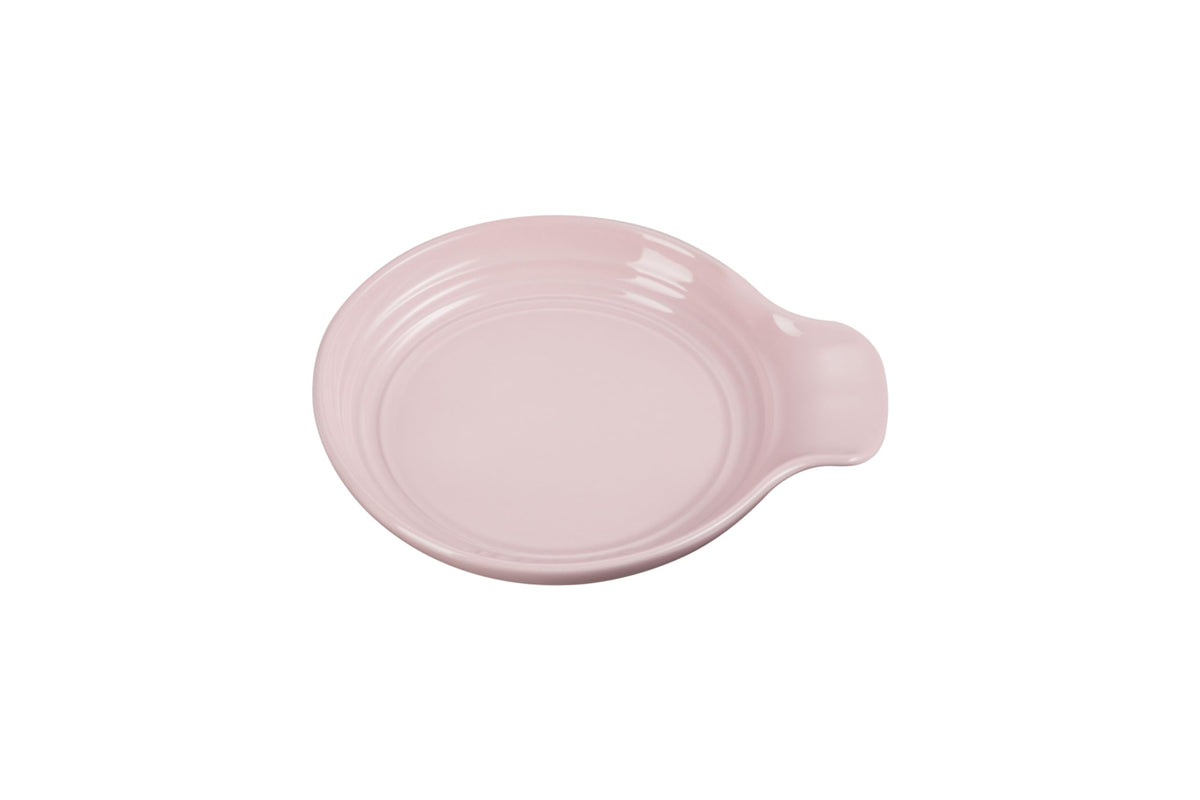 Le Creuset spoon rest round 6-inch chiffon pink keeps counters clean.