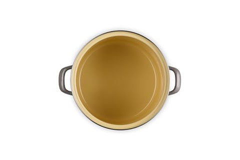 Le Creuset stockpot with stainless steel knob ensures safe, cool handling.