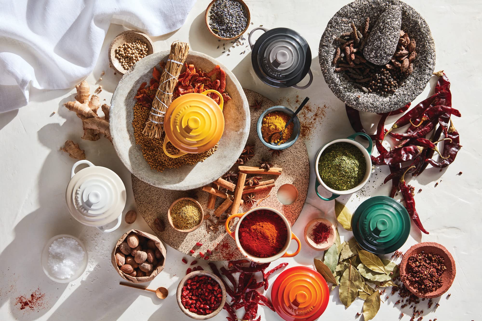 Le Creuset stoneware collection shows oyster glaze finish and durability.