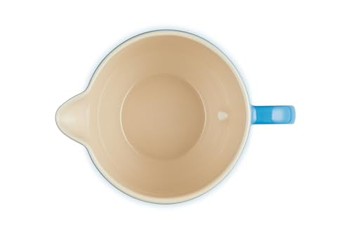 Le Creuset stoneware glaze close-up showing a smooth, nonporous surface.
