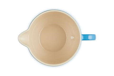 Le Creuset stoneware glaze close-up showing a smooth, nonporous surface.