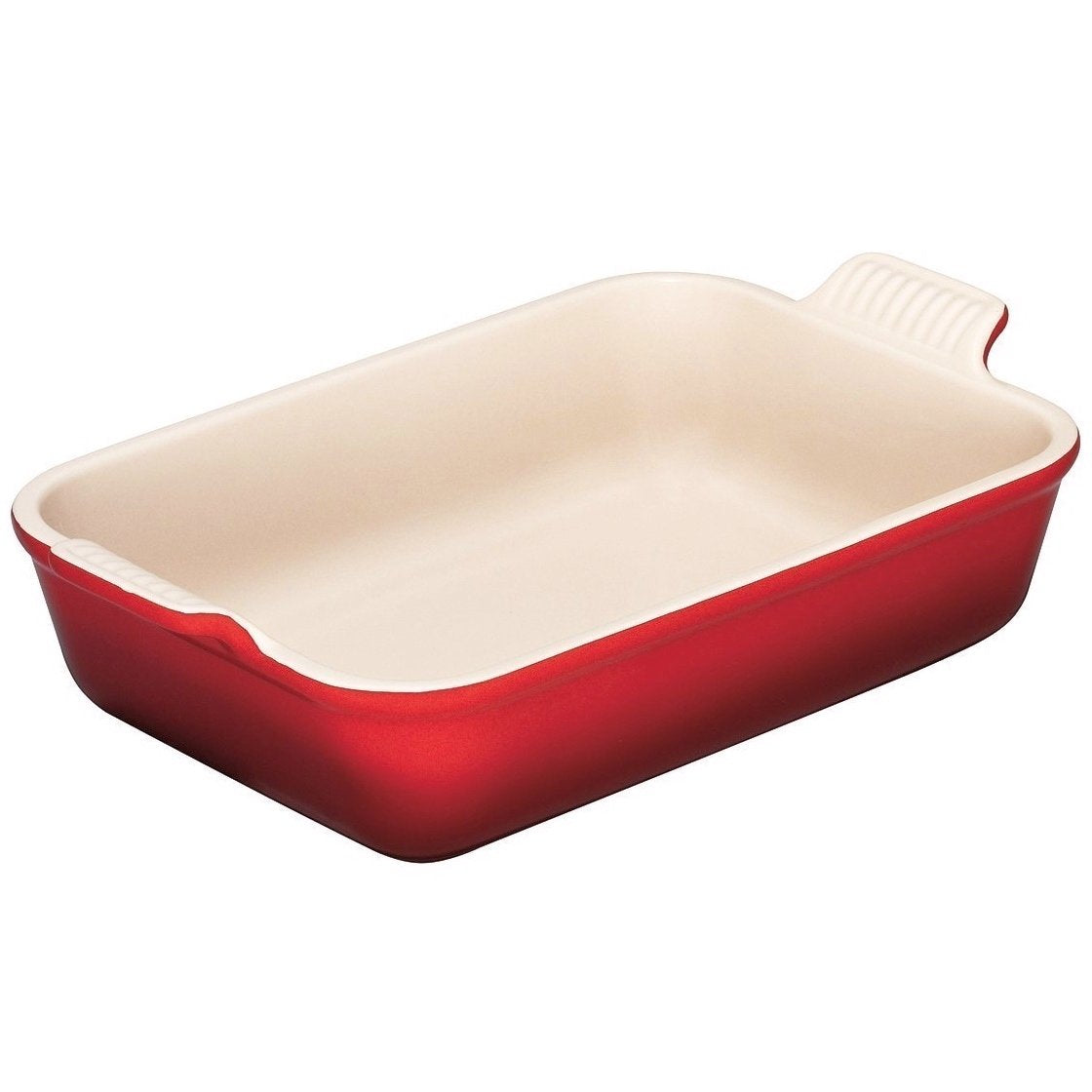 Le Creuset heritage stoneware rectangular dish in cerise glaze, even heating for baking and serving.