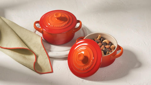 Le Creuset cocotte on table, perfect for serving individual portions.
