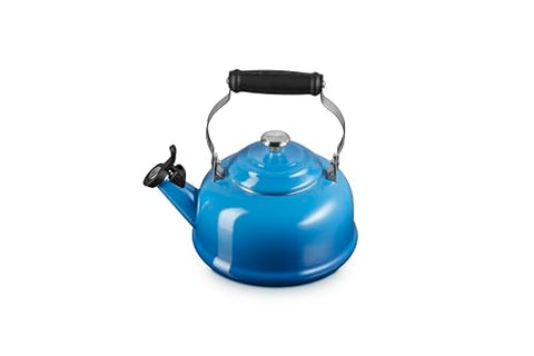Le Creuset tea kettle with whistle visible signals when water reaches a boil.