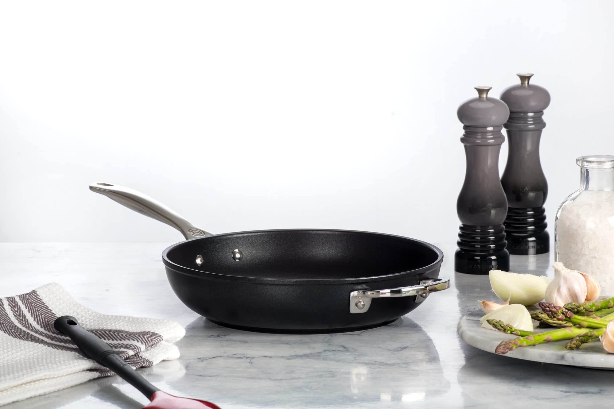Le Creuset PRO pan on stove demonstrating all cooktop compatibility