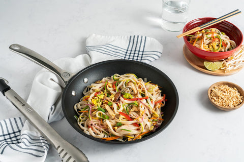 Le Creuset Toughened Nonstick PRO 10-inch pan, dishwasher-safe for easy cleanup.