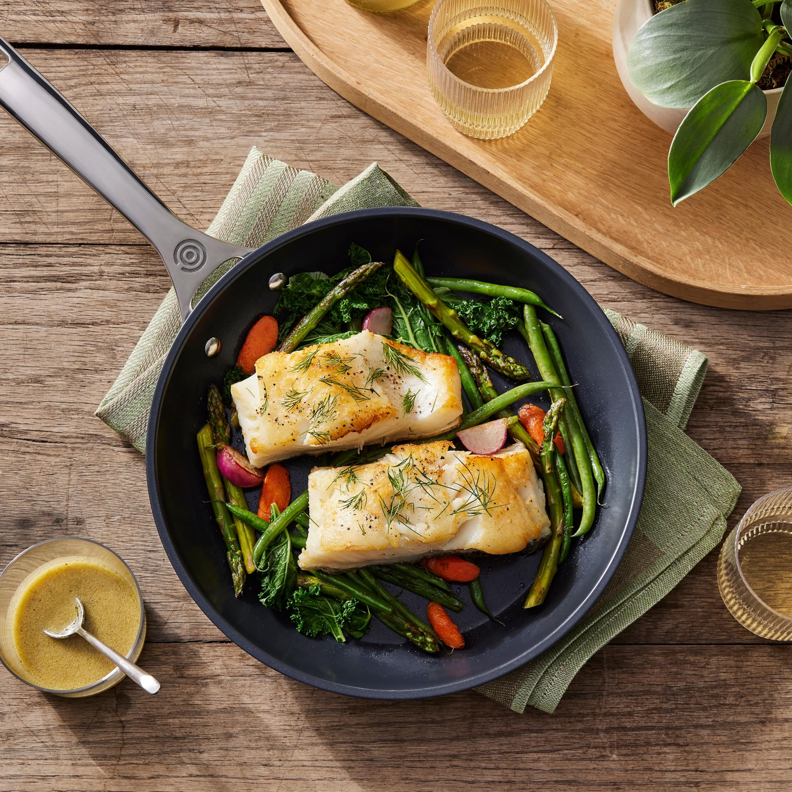 Le Creuset Toughened Nonstick PRO 10-inch pan, safe with metal utensils for versatile cooking.
