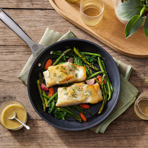 Le Creuset Toughened Nonstick PRO 10-inch pan, safe with metal utensils for versatile cooking.