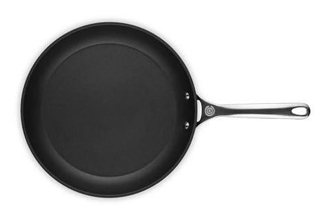 Le Creuset Toughened Nonstick PRO 12-inch in-use omelette shot emphasizes effortless flipping and clean release