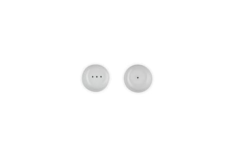 Le Creuset white shakers—porcelain-enamel coating close-up, resistant to chipping.