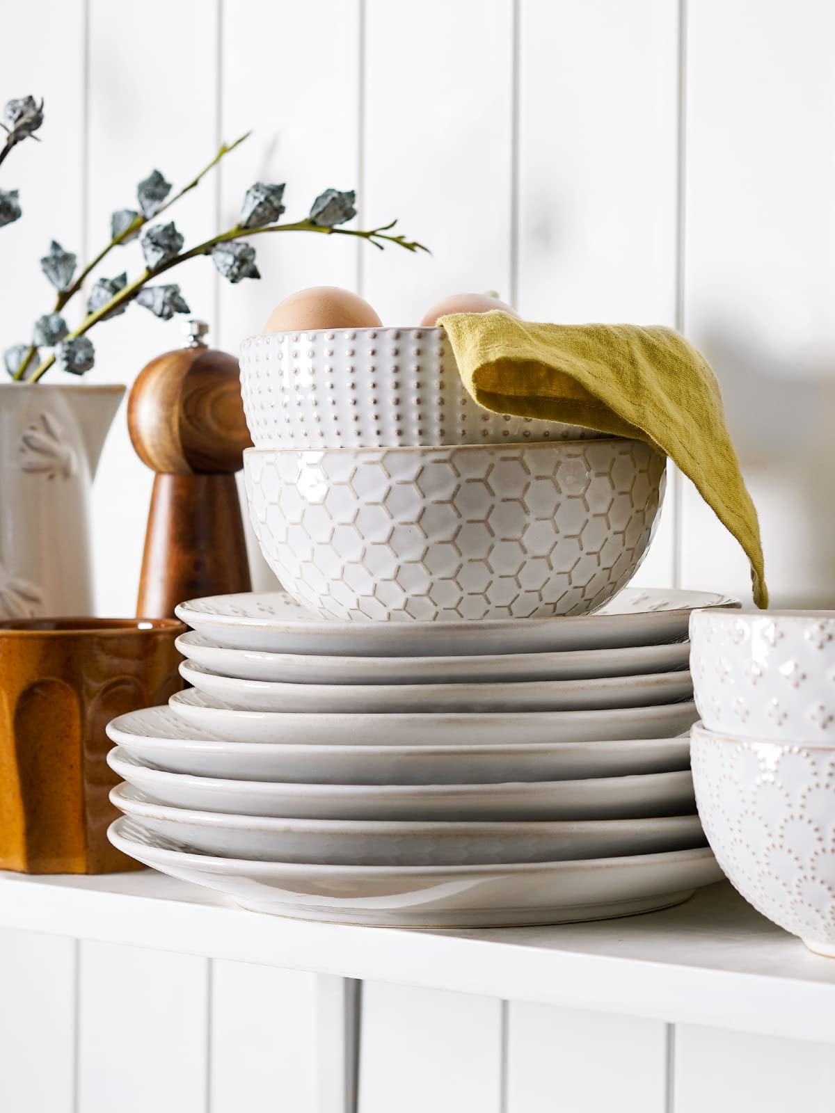 LE TAUCI embossed-pattern bowls complement plates for cohesive table setting