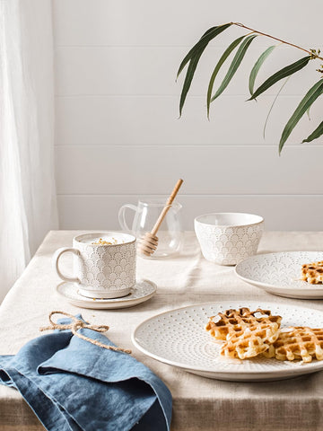 LE TAUCI embossed ceramic cups showing textured pattern and comfortable grip
